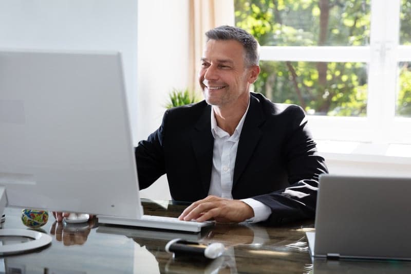 A professional at work in a bright office interior with natural light